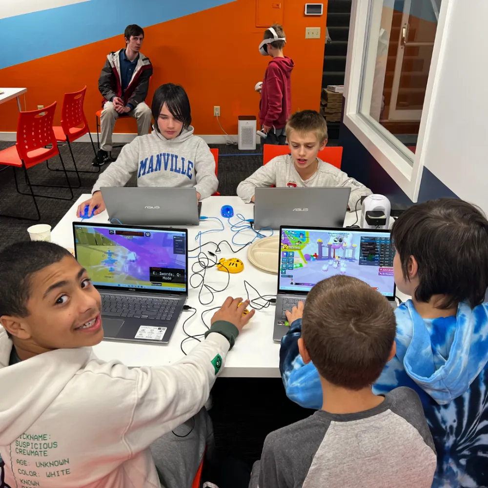 A Code Wiz Plainsboro coach working with a student